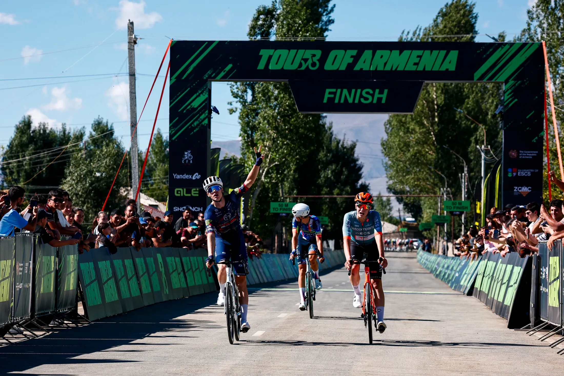 The sprint for the line under the finish gantry